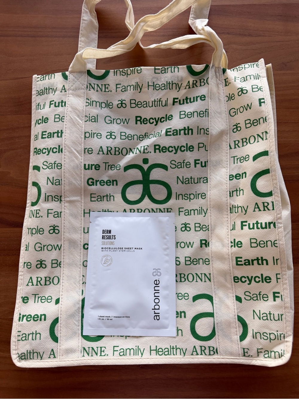 Arbonne Reusable Tote Bag in Natural and Green & Biocellulose Sheet Mask
